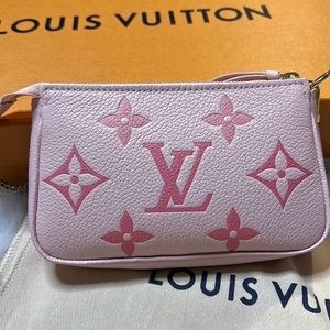 Authentic Louis Vuitton mini pochette accessories By the Pool